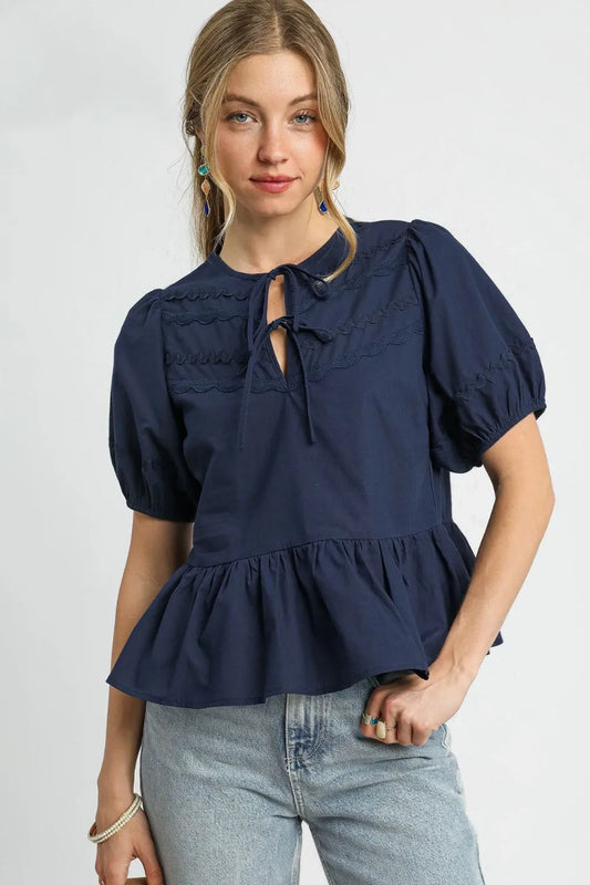 women wearing navy blue puffed sleeve blouse